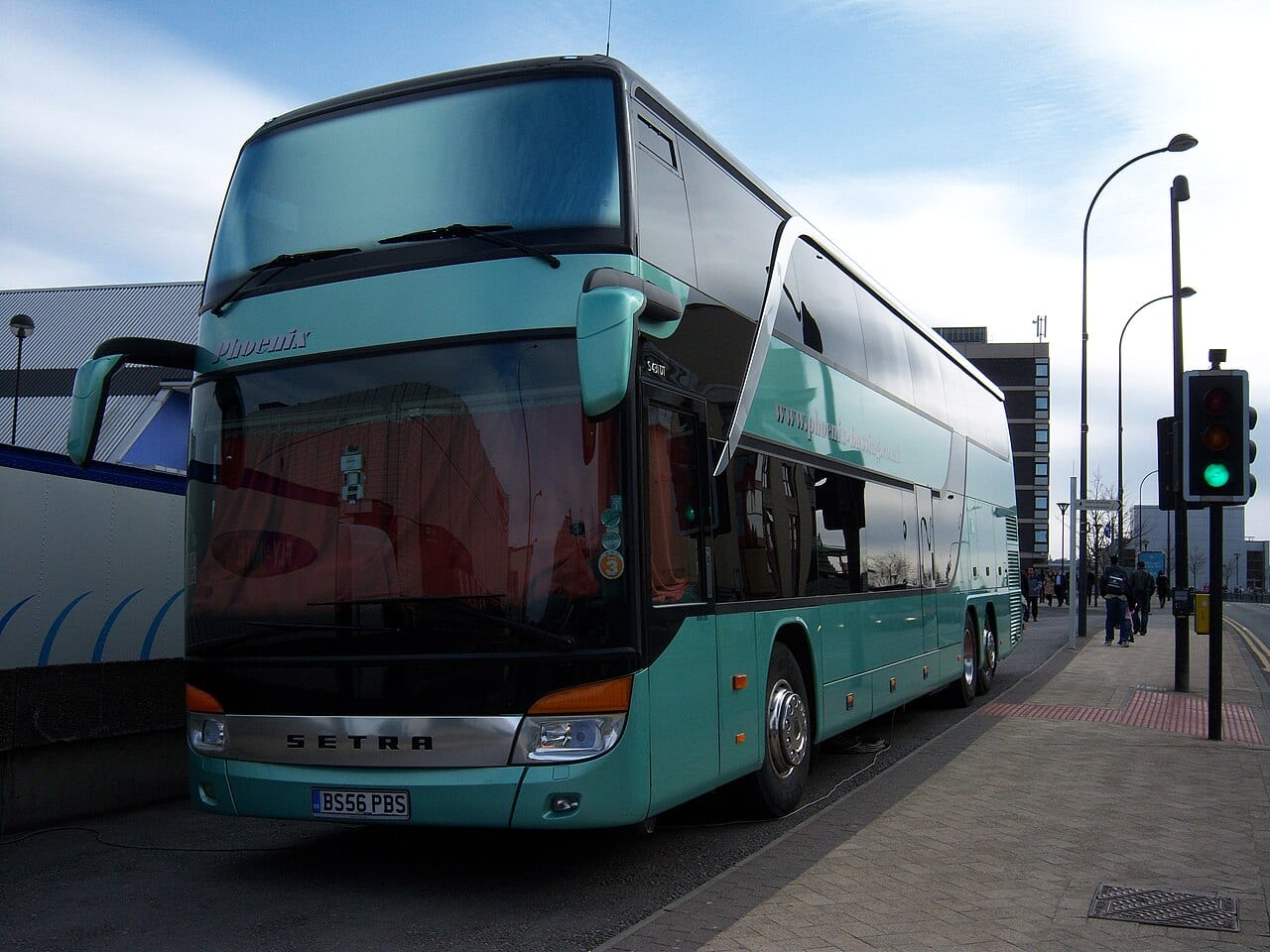 Full-size touring coach parked for boarding