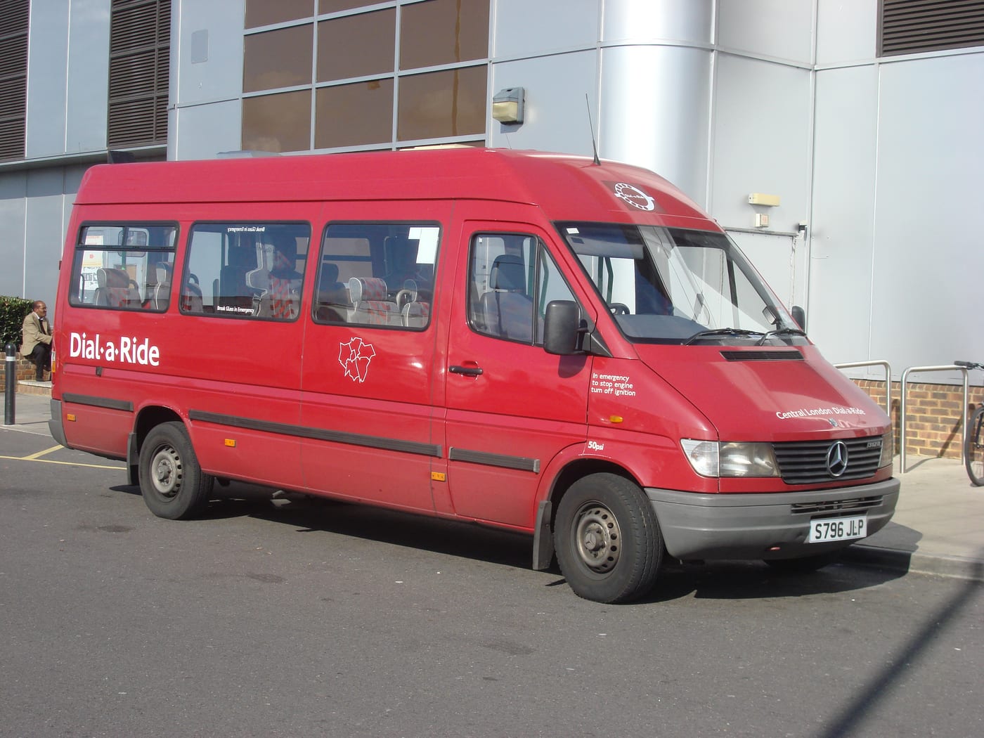 Minibus with side door open for boarding